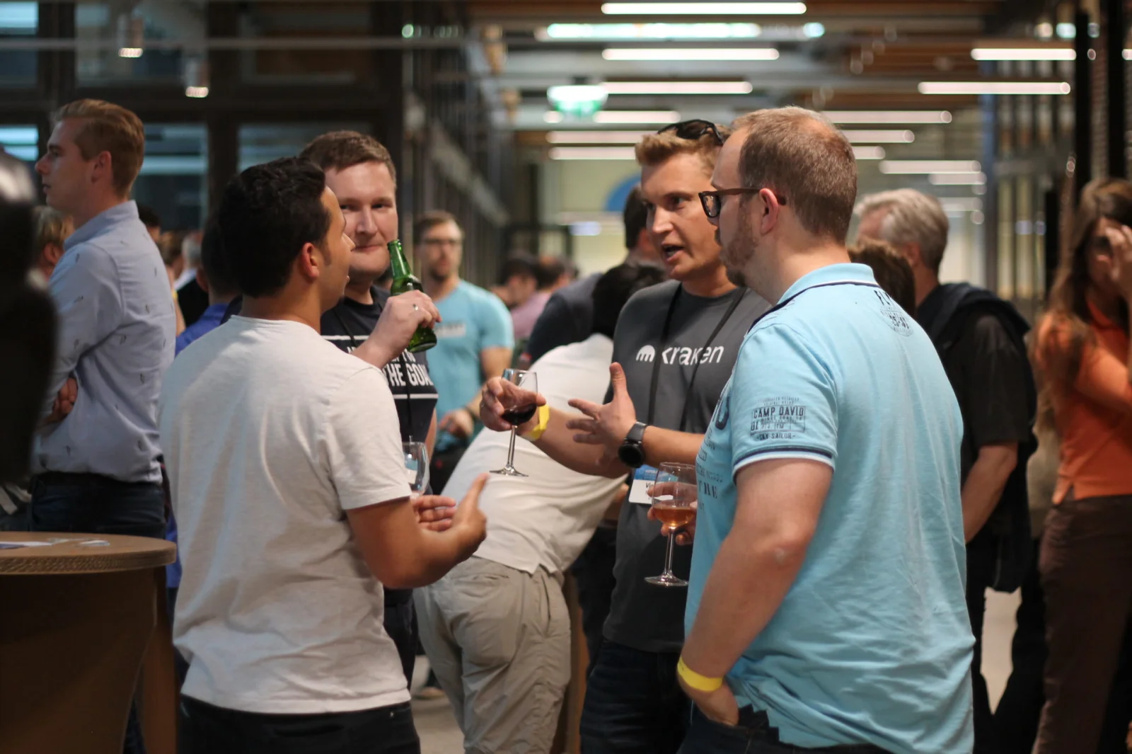 Attendees talking over drinks at a BCNL Foundation networking event