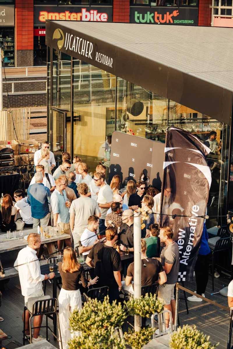 BCNL Foundation members networking on the outdoor terrace at IJcatcher Restobar in Amsterdam