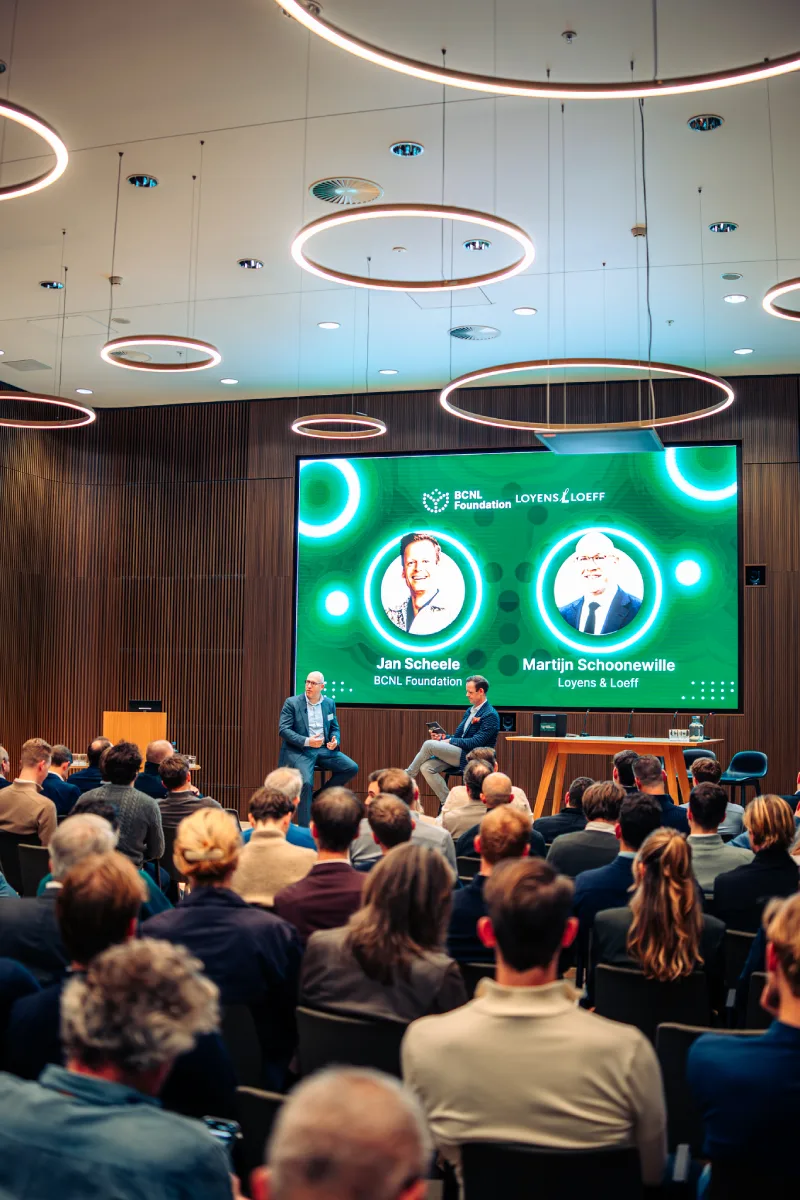 Jan Scheele of BCNL Foundation and Martijn Schoonewille of Loyens & Loeff on stage during a BCNL panel session
